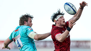 <p>Exeter's Jonny Gray competes in the air at the lineout with Thomas Ahern of Munster </p>