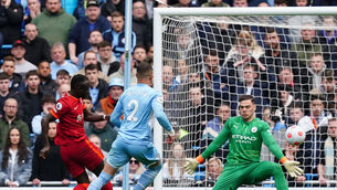 <p>Liverpool's Sadio Mane scores their side's second goal of the game during the Premier League match at the Etihad Stadium, Manchester. Picture date: Sunday April 10, 2022.</p>