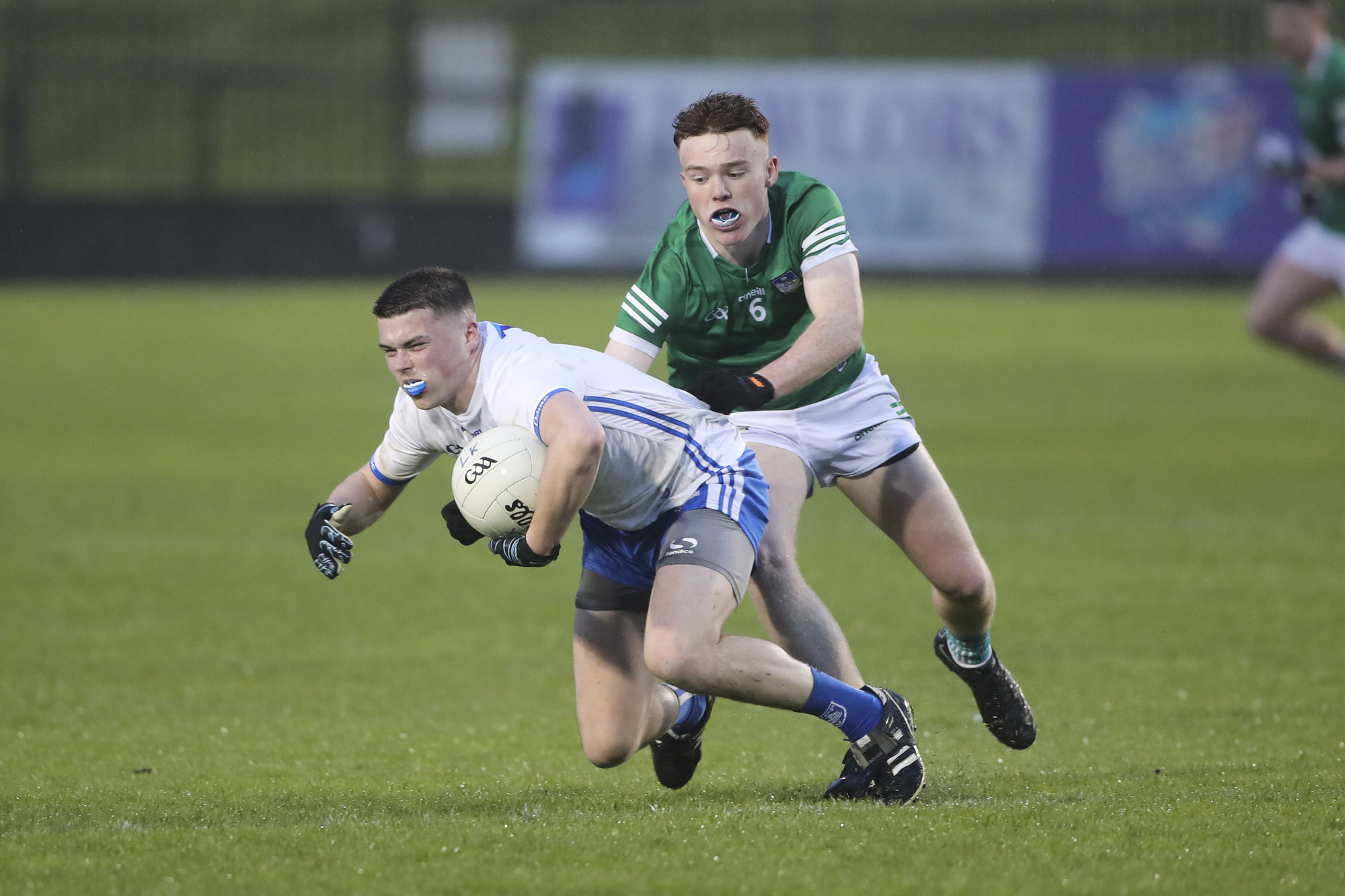 Waterford’s Kealan Taylor gets to the ball ahead of Limerick’s Aaron Neville in last night’s EirGrid Munster U20 FC quarter-final at Fraher Field, Dungarvan. 	Picture: Patrick Browne