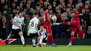 <p>On the stretch: Liverpool's Roberto Firmino has an attempt on goal as his side held off Benfica at Anfield. Picture: Peter Byrne/PA Wire.</p>