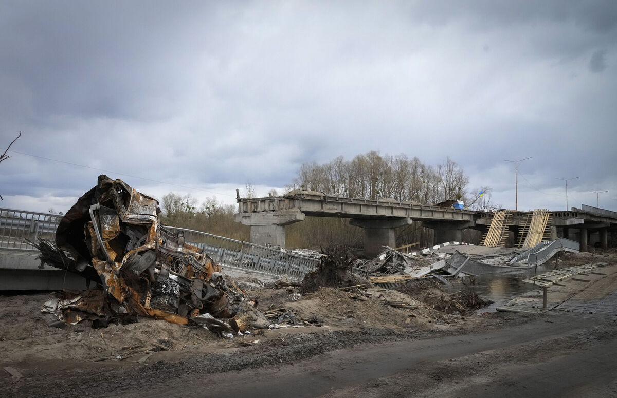 A destroyed car seen at a destroyed bridge in the village of Dymer, in Kyiv. Picture: AP Photo/Efrem Lukatsky