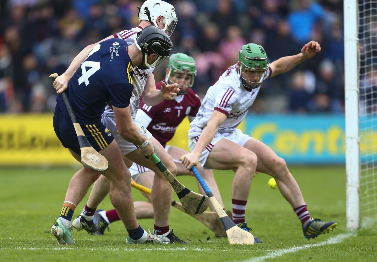TOUCH: Wexford's Conor McDonald manages to score a goal despite pressure from Galway defenders.