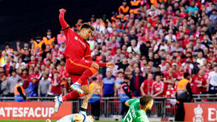 <p>Liverpool's Roberto Firmino (top left) attempts to control the ball under pressure from Manchester City's Joao Cancelo and goalkeeper Zack Steffen during the Emirates FA Cup semi final</p>