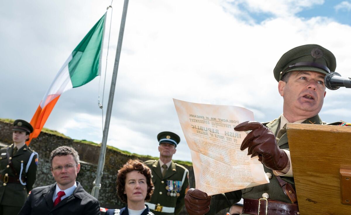 Lt. Cl. Robert Hurley reads the Proclamation of Independence as Patrick O'Donovan, Minister of State at the Department of Public Expenditure and Reform and the Mayor of County Cork Cllr. Gillian Coughlan look on. Photo: John Allen Lt. Cl. Robert Hurley reads the Proclamation of Independence as Patrick O'Donovan, Minister of State at the Department of Public Expenditure and Reform and the Mayor of County Cork Cllr. Gillian Coughlan look on. Photo: John Allen