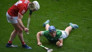 <p>HARD BALL: Limerick's  Mike Casey wins possession ahead of Patrick Horgan at Páirc Uí Chaoimh on Sunday. </p>
