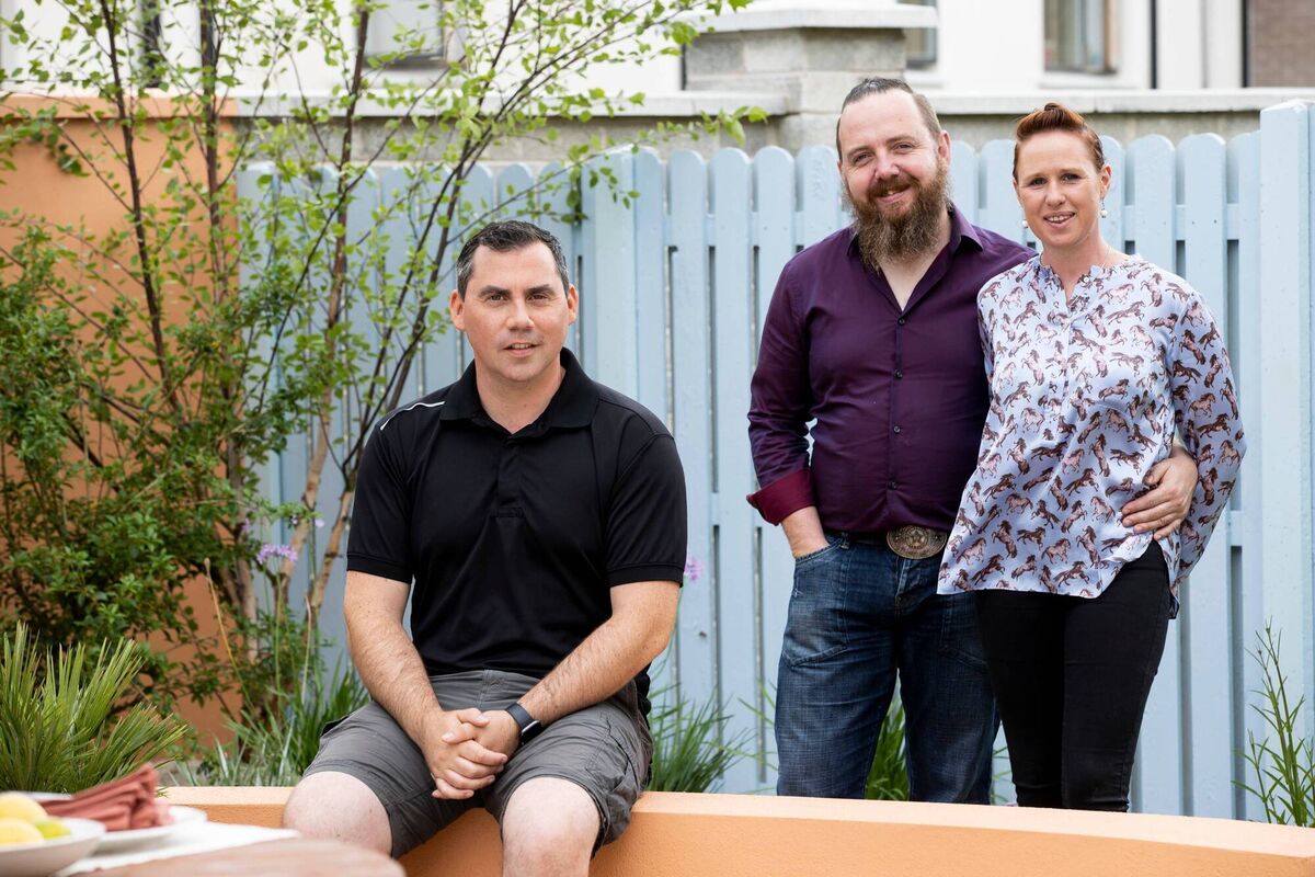 Super Garden: Designer Paul Ferry with homeowners Tom and Catherine Moore. Picture: Andres Poveda