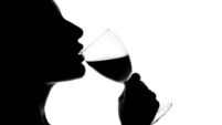 Silhouette Of Woman Drinking Wine
