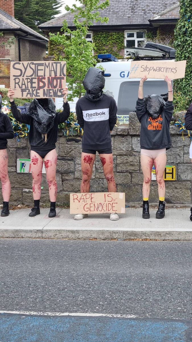 Participants stood in silence for half an hour this afternoon with bags over their heads and signs. Participants stood in silence for half an hour this afternoon with bags over their heads and signs.