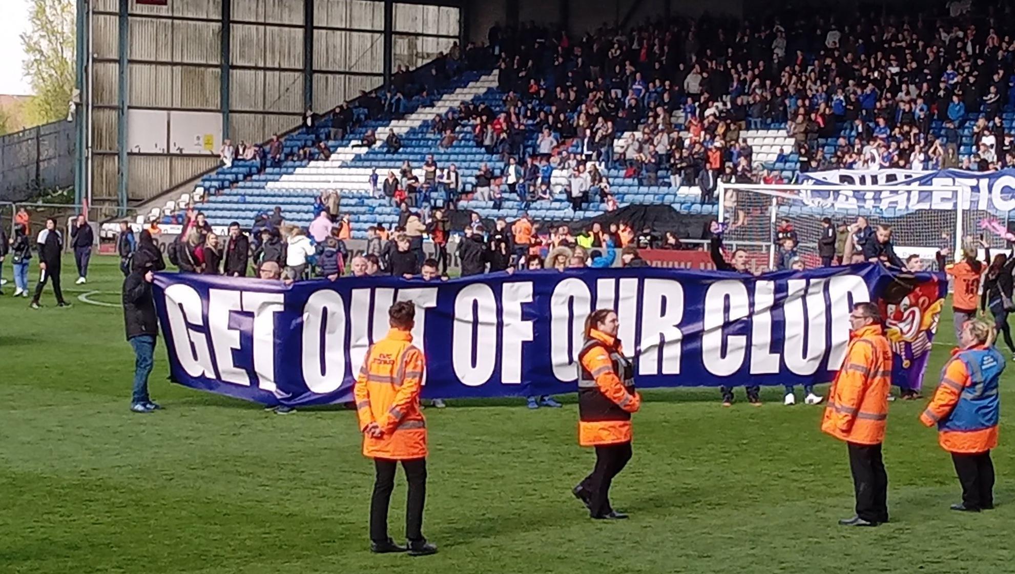 Picture taken with permission from the twitter feed of @Leemorris__ of the pitch invasion during the Sky Bet League Two match between Oldham Athletic and Salford City at Boundary Park, Oldham. Picture: Lee Morris/PA Wire 