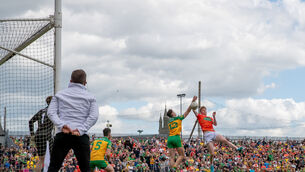 <p>Michael Langan of Donegal with Rian O'Neill of Armagh</p>