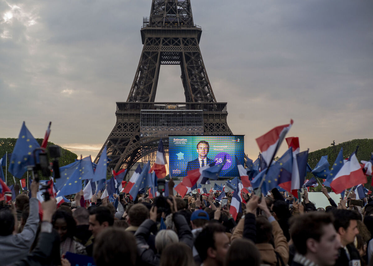 French President Emmanuel Macron celebrates with supporters in front of the Eiffel Tower Paris, France, Sunday, April 24, 2022. Picture: AP Photo/Rafael Yaghobzadeh