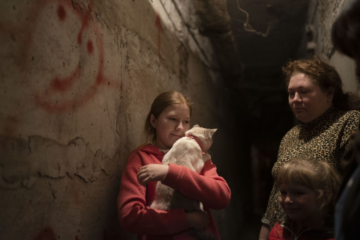 Elizabeth, 12, holds her cat as she takes shelter with her family inside the basement of a residential building during a Russian attack in Lyman, Ukraine. Picture: AP Photo/Leo Correa