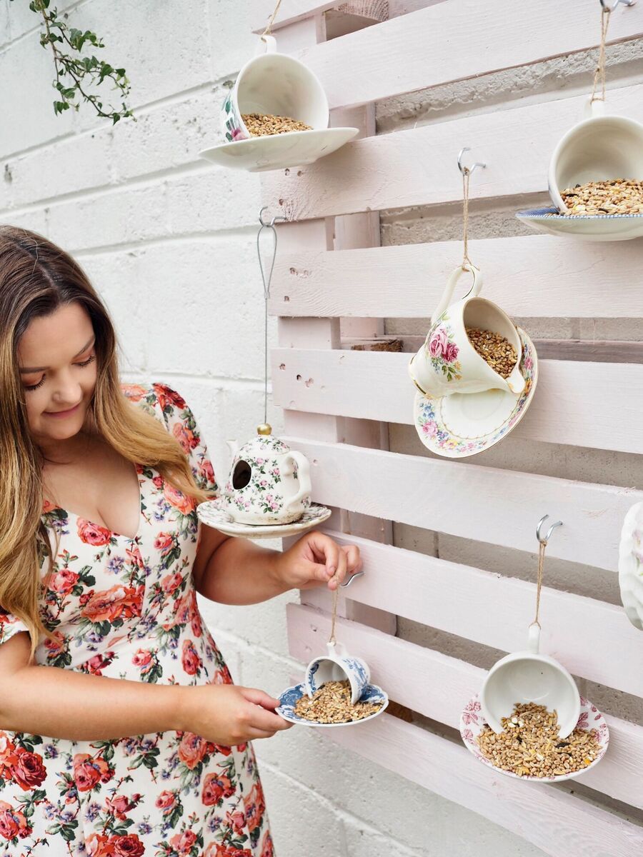  How’s this for an idea? Vintage cups and saucers become bird feeders with the help of a drill and some string.