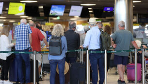 <p>People queuing at Dublin Airport last month. The airport says it is "on track" to have security staff at full capacity by June, alleviating the problem. Picture: PA</p>
