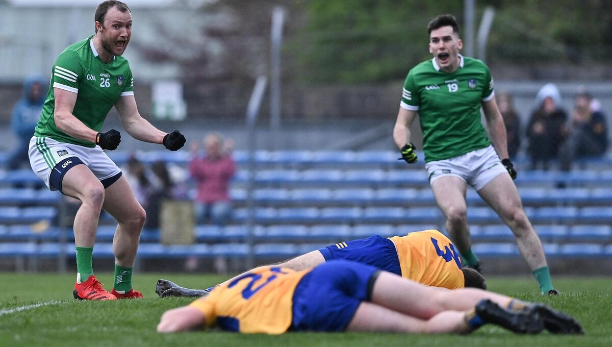 Thirteen years of hurt: Robbie Bourke of Limerick, left, celebrates after scoring his side's second goal, in extra-time as the visitors secured a first Munster SFC win over Clare since 2009. 