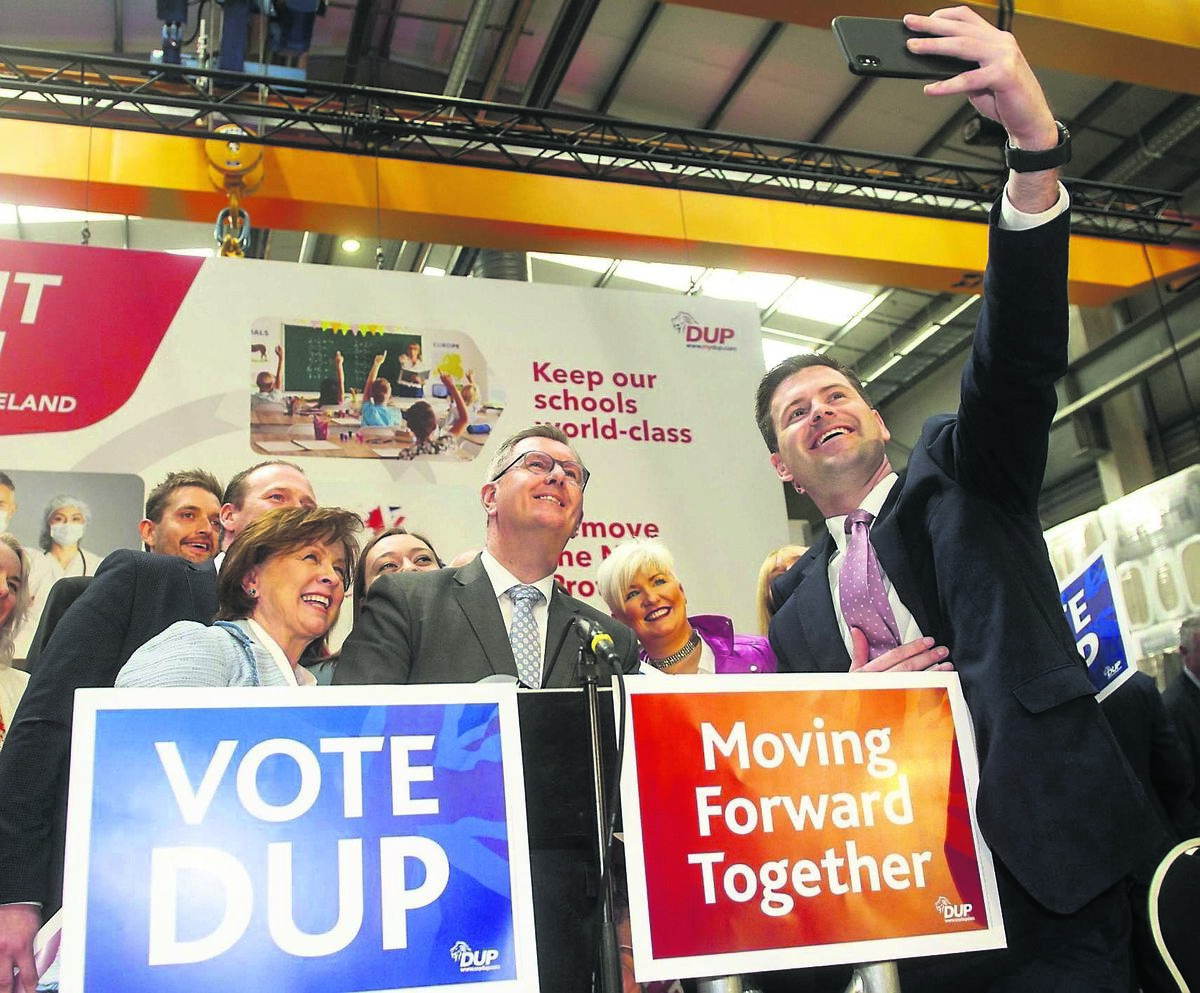 Jeffrey Donaldson (centre) at the launch of the DUP’s election manifesto last Thursday. His party has hardened its position on the protocol in a bid to retain votes it is at risk of shedding to the Traditional Unionist Voice (TUV). Picture: Mark Marlow/PA