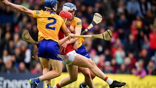 <p>IS THERE A KICK IN CORK?: Alan Connolly kicks a goal despite being tackled by Clare's Rory Hayes and Diarmuid Ryan at FBD Semple Stadium in Thurles.</p>