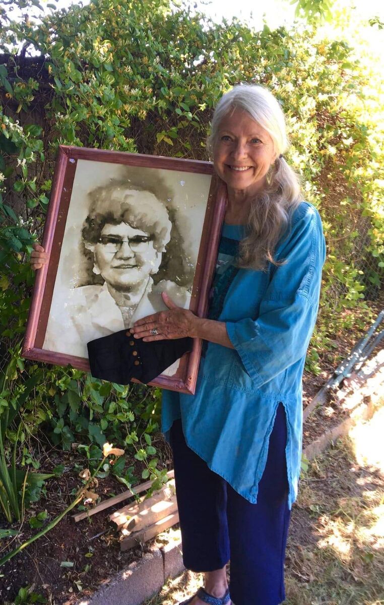 Jackie holding the moneybelt her grandmother, Alice Middleton McDougall, was wearing when the ship was sunk. It is being presented to the Old Head Signal Tower and Lusitania Museum.