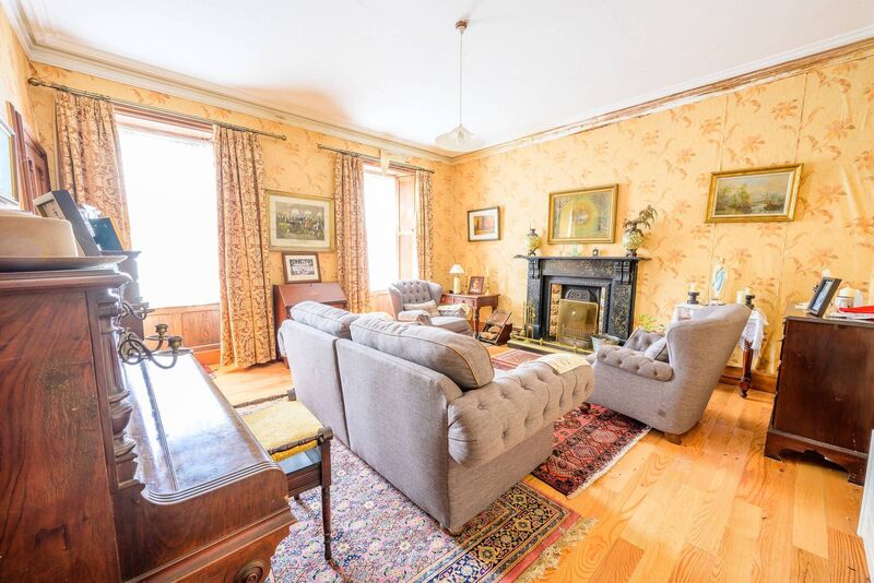 One of the two impressive reception rooms.  Windows in front are double glazed sashes, with working shutters