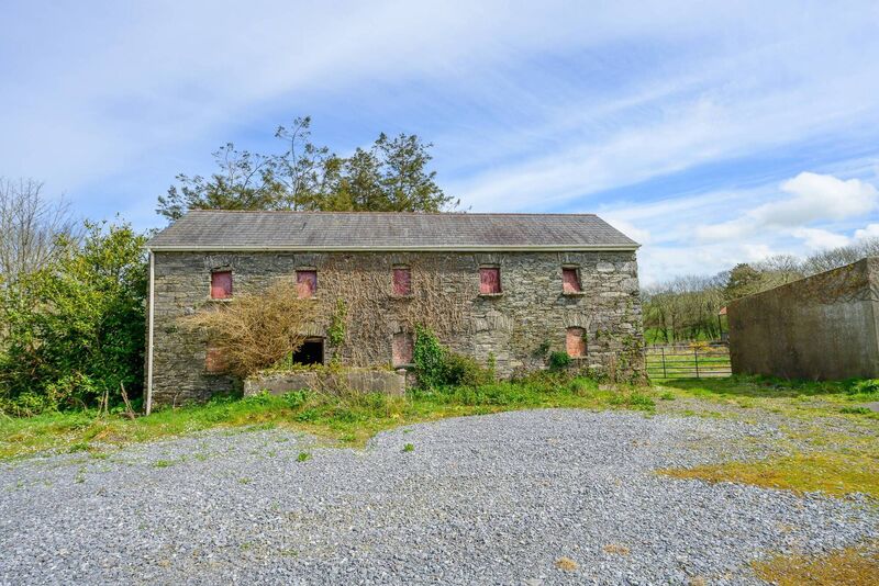 Lofted outbuilding has ocular gable window 