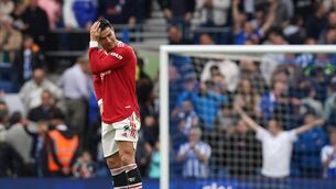 <p>Manchester United's Cristiano Ronaldo reacts after his side concedes a third goal during the Premier League match at the AMEX Stadium.</p>