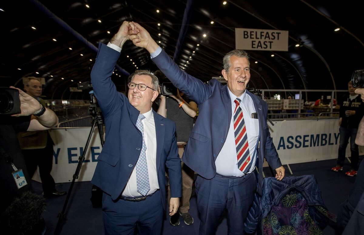 DUP leader Jeffrey Donaldson celebrates with Edwin Poots at the Titanic Exhibition Centre, Belfast. Picture: Liam McBurney/PA