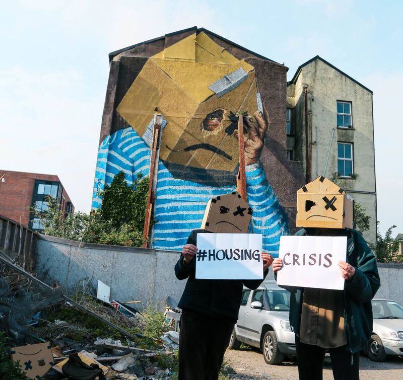 At a public meeting in Cork, members of the National Homeless and Housing Coalition called for a national referendum on a constitutional right to housing. Protestors are pictured at a mural on South Main Street.