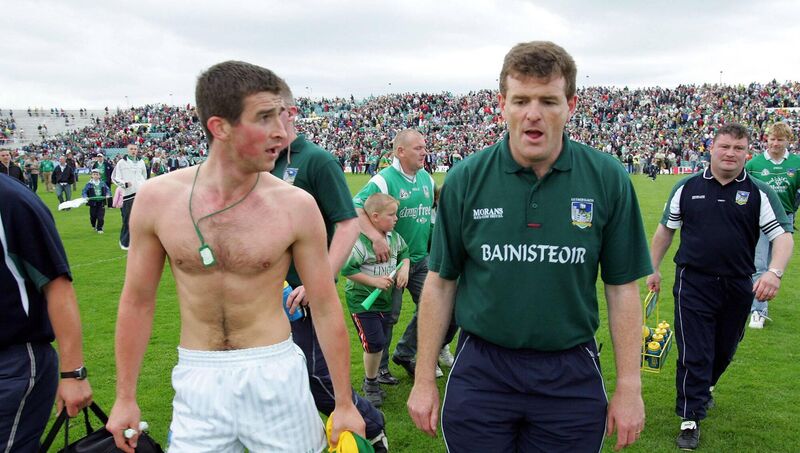 What might have been: Limerick manager Liam Kearns and Conor Fitzgerald leave the pitch after the 2004 Munster football final, when they drew with Kerry only to lose the replay.