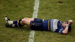 <p>Leinster captain Reggie Corrigan lies injured before being substituted during the Heineken Cup Pool 6 Round 6 match between Toulouse and Leinster at the Stade Les Sept Denier in Toulouse, France. Photo by Brendan Moran/Sportsfile</p>