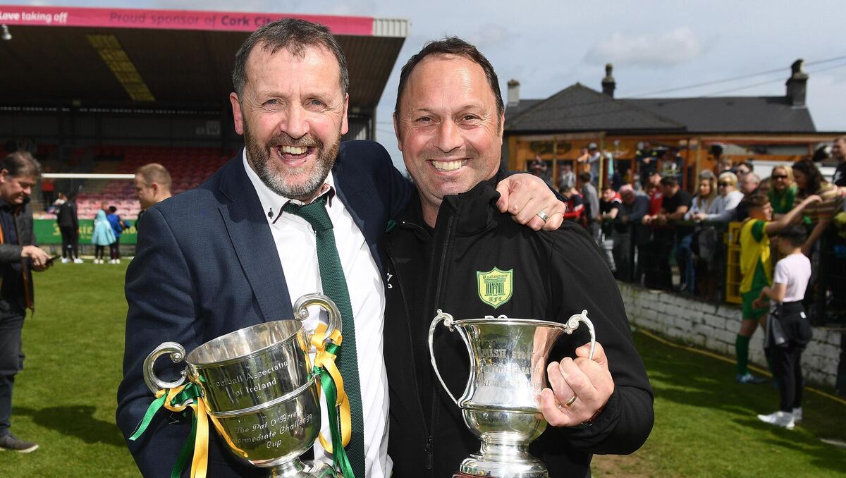  Silverware suits you: Rockmount stalwarts Billy Cronin and Derek Clarke after defeating Bluebell United in the FAI Centenary Intermediate cup final at Turner's Cross. 