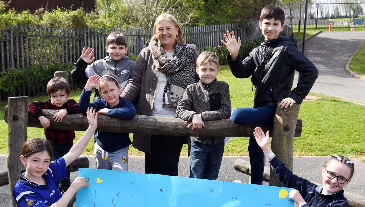 Pupils of Scoil Niocláis in Frankfield, Cork, and deputy principal Rosemary Lee welcome children newly arrived from Ukraine to the school last month. Picture: Denis Minihane