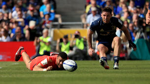 <p>Hugo Keenan of Leinster with Matthis Lebel of Stade Toulousain during the Heineken Champions Cup semi-final at the Aviva Stadium in Dublin, Ireland. Donall Farmer/PA Wire.</p>