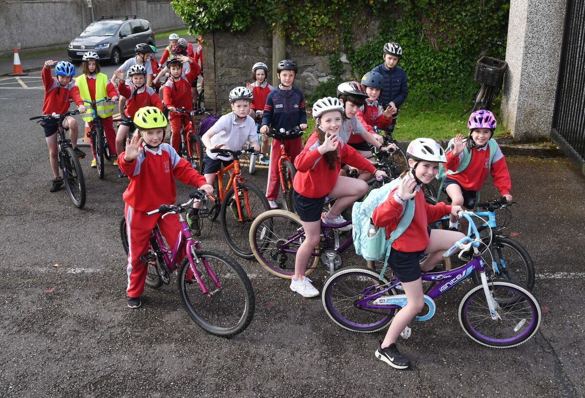 Pupils arriving at the school after taking part in Bus na Rothar, Cycle Bus to School, from Rossbrook, Model Farm Road, Cork, and areas along the route to Gaelscoil Uí Riada, Wilton, during National Bike Week. Pic: Denis Minihane