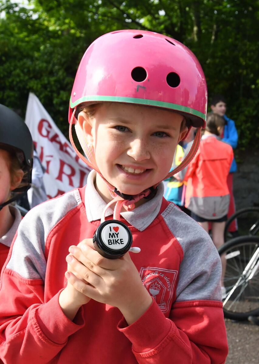 Elle collecting a bell for her bike when she took part in Bus na Rothar, Cycle Bus to School, from Rossbrook, Model Farm Road, Cork, and areas along the route to Gaelscoil Uí Riada, Wilton, during National Bike Week. Pic: Denis Minihane.