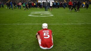 <p>Cork's Eoghan sits alone and dejected after their Bord Gais 2018 All-Ireland U21 Championship final defeat to Tipperary at the Gaelic Grounds. Photo by Piaras Ó Mídheach/Sportsfile</p>