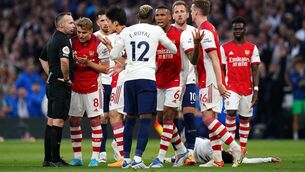 <p>All alone in the middle: Referee Paul Tierney shows red card Arsenal's Rob Holding for a foul on Tottenham Hotspur's Son Heung-min during the Premier League match at Tottenham Hotspur Stadium.</p>