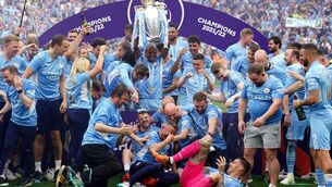 <p>Manchester City's Fernandinho lifts the Premier League trophy following the the Premier League match at The Etihad Stadium, Manchester. Picture: Martin Rickett/PA Wire. </p>
