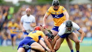 <p>Clare's Cian Nolan and Ian Galvin with Shane McNulty and Mark Fitzgerald of Waterford. ©INPHO/James Crombie</p>