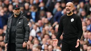 <p>Manchester City manager Pep Guardiola (right) and Liverpool manager Jurgen Klopp on the touchline. Martin Rickett/PA Wire.</p>