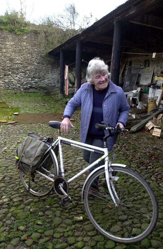 Travel writer Dervla Murphy taking out her trusty bicycle in preparation for one of her many trips.