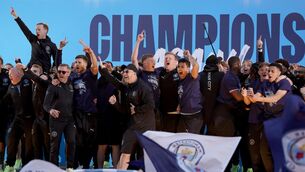 <p>Manchester City players on stage during the Premier League trophy parade in Manchester. Zac Goodwin/PA Wire.</p>