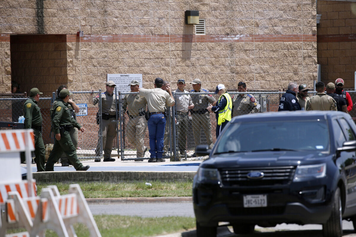 Law enforcement, and other first responders, gather outside Robb Elementary School following a shooting, Tuesday, May 24, 2022, in Uvalde, Texas. (AP Photo/Dario Lopez-Mills)