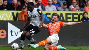 <p>Derby County's Festy Ebosele (left) has been called up to Stephen Kenny's Ireland squad. Martin Rickett/PA Wire.</p>