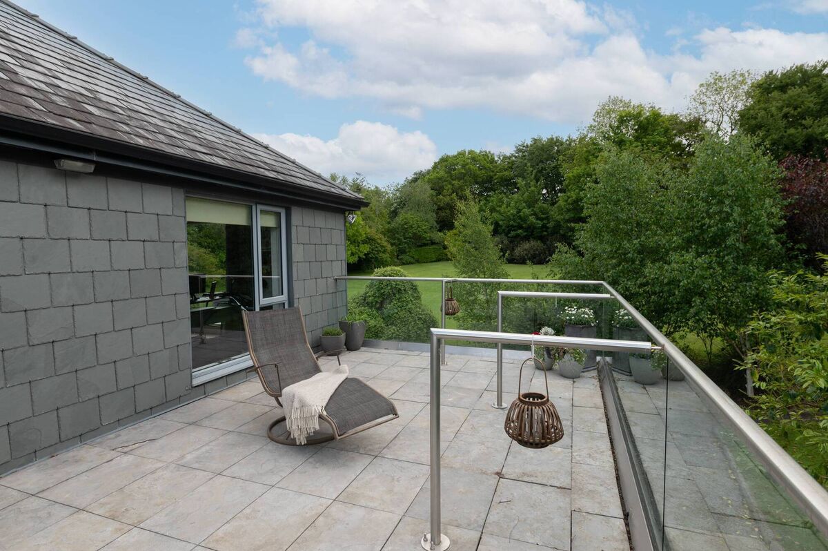 Second balcony at far end of house