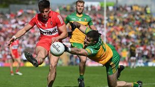 <p>29 May 2022; Conor Doherty of Derry in action against Caolan McGonagle of Donegal during the Ulster GAA Football Senior Championship Final between Derry and Donegal at St Tiernach's Park in Clones, Monaghan. Photo by Stephen McCarthy/Sportsfile</p>