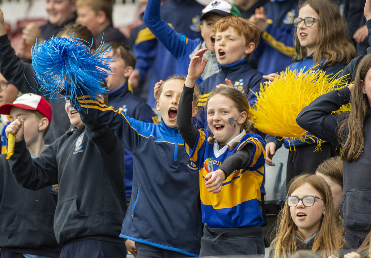  Gaelscoil Carrig Ui Leighin fans supporting their team against Ballinora at Páirc Uí Rinn. 