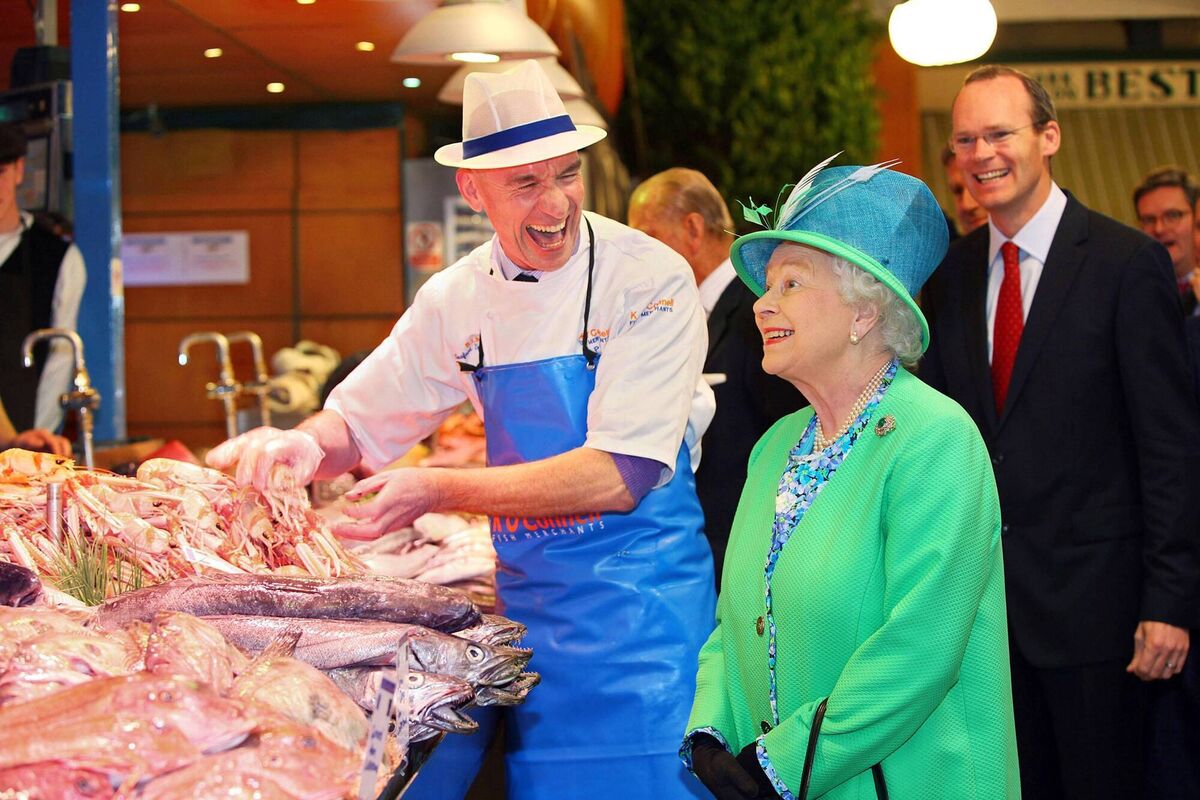 Queen Elizabeth meeting fishmonger Pat O'Connell at The English Market in Cork City on her State visit to Ireland in 2011. Picture: Maxwells/PA