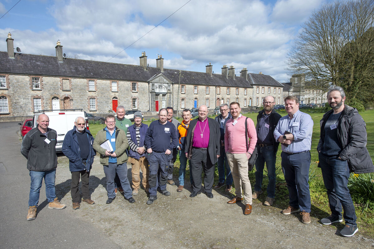 The Church of Ireland is doing up eight houses it owns in Kingston College to house Ukrainian refugees. Bishop Paul Colton is shown the properties by co-ordinator Charlie Daly, builders, and volunteers 	Picture: Michael Mac Sweeney/Provision