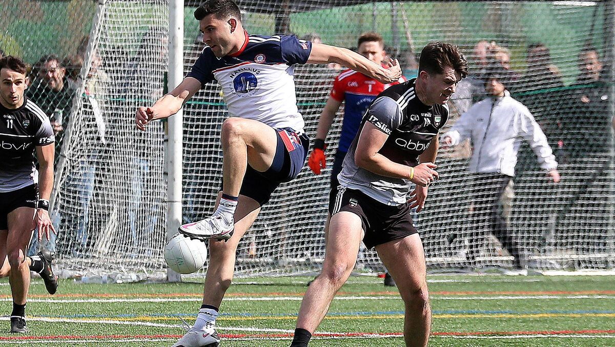 In the thick of it: New York’s Jamie Boyle with Paddy O’Connor of Sligo in this year's Connacht Championship clash. 