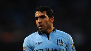 <p>Carlos Tevez has retired at the age of 38 (Martin Rickett/PA)</p>